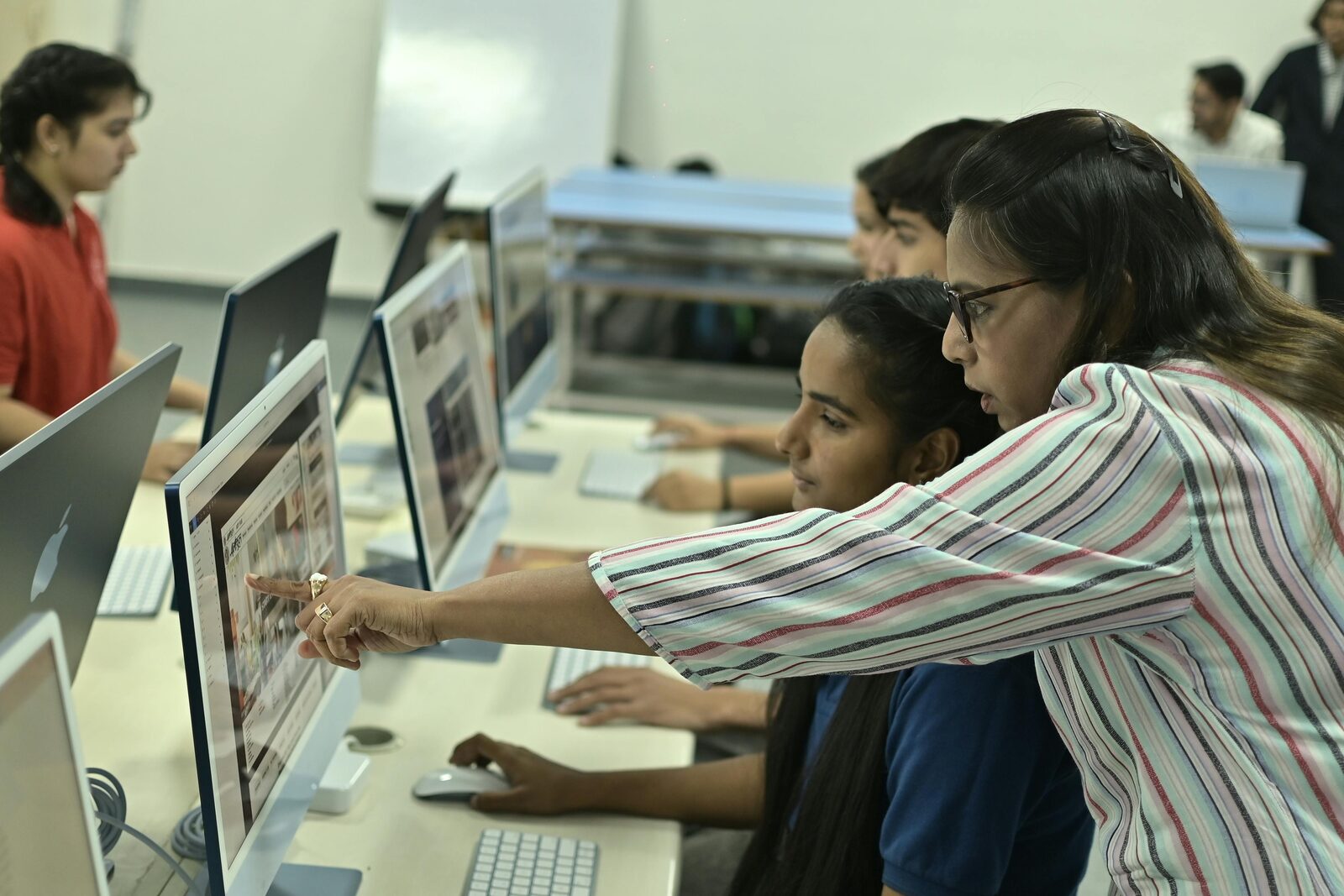 Students working at computers in the ESkill Institute classroom, Multan